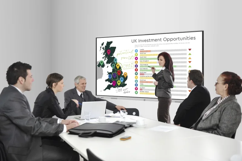 Businesswoman drawing a diagram during the presentation at offic